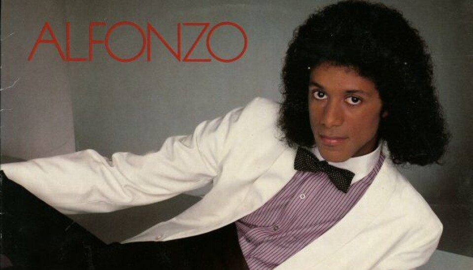 This Lost '80s Singer Sounded Just Like Michael Jackson A man in a Thriller-like pose wearing a white jacket.