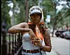 Latoya Coleman in a new york hat and orange scarf