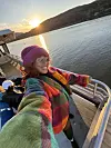 Shyvonne in warm fall clothing on a ferry out on the water.