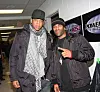 Jay-Z and DJ Clue standing backstage near Power 105.1 signs at IZOD Center