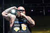 Action Bronson raps onstage at BottleRock 2024 wearing a New York Knicks tank top and sunglasses.