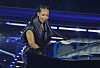 Alicia Keys plays a grand piano and sings on stage at the Sanremo Festival.