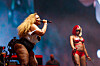 Lizzo and Sexyy Red perform together on a brightly lit Coachella festival stage.