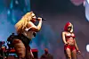 Lizzo and Sexyy Red perform together on a brightly lit Coachella festival stage.
