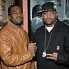 Kanye West and Damon Dash posing together at a film premiere event