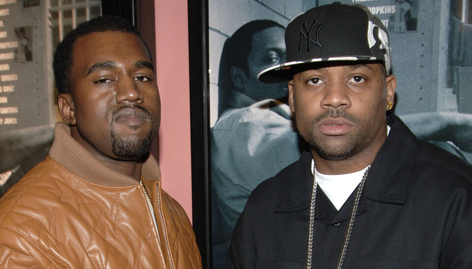 Kanye West and Damon Dash posing together at a film premiere event