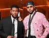 Usher and Chris Brown pose together at a Louis Vuitton men's fashion show in Paris.