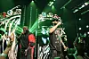 Rick Ross and French Montana performing onstage under green lights during a VERZUZ event.
