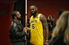 Drake speaks with LeBron James in a Lakers jersey after an NBA game at Scotiabank Arena.