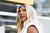 Serena Williams smiles while arriving at the Ferrari hospitality suite at the Miami Grand Prix.