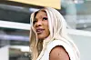 Serena Williams smiles while arriving at the Ferrari hospitality suite at the Miami Grand Prix.