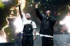 Bow Wow and Jermaine Dupri performing onstage in front of bright pyrotechnics at Roots Picnic.