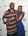 DMX and Tashera Simmons smiling together at a Billboard event in front of a step-and-repeat backdrop.