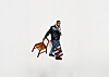 Man standing next to a wooden chair draped with an American flag on a white background.