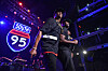 Jay-Z and Memphis Bleek perform onstage in front of a glowing South 95 sign.