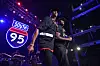 Jay-Z and Memphis Bleek perform onstage in front of a glowing South 95 sign.