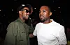 Kanye West and Kid Cudi standing together at the 2012 BET Awards.