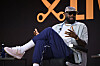 LeBron James seated onstage speaking during The Shop Live panel at Fanatics Fest NYC.