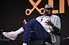 LeBron James seated onstage speaking during The Shop Live panel at Fanatics Fest NYC.