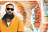 Bearded man in sunglasses and an orange jacket standing before a map of Maryland and the Chesapeake Bay.