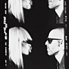 Black-and-white portrait of two pairs of people facing each other, with a platinum-haired woman and a man in sunglasses.