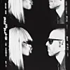 Black-and-white portrait of two pairs of people facing each other, with a platinum-haired woman and a man in sunglasses.