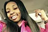 Kenneka Jenkins in pink coat