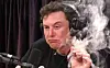 Elon Musk smokes a blunt, allegedly for the first time, on Joe Rogan's podcast.