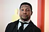 Jonathan Majors attends the 95th Annual Academy Awards at the Dolby Theatre in Hollywood, California on March 12, 2023 (photo by Frederic J. Brown / AFP).