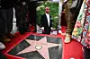 A portrait of US rapper Tupac Shakur is displayed next to his newly unveiled star during his Hollywood Walk of Fame star ceremony in Hollywood, California, on June 7, 2023.