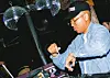 Brooklyn-based producer Stas Thee Boss DJing at a bar.
