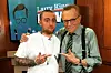 Revisiting the late talk show host's chats with iconic musicians. Journalist, talk show host, and inquisitive everyman, Larry King died on Saturday morning at the age of 87. Known for his candid questioning, broad interests, and an unbridled fandom of his guests, King found a slot for himself in every news cycle iteration since the mid-50s. During his first 30 years in years in journalism, King jumped from radio to print to a primetime slot on CNN with Larry King Live in 1985, quickly establishing himself as the face of the network. King's namesake program ran for 25 years and featured over 6,000 interviews with everyone from Jerry Seinfeld to The Dalia Lama to Amber Rose to Mike Tyson (several times over,) to every US president since Ford. And somewhere in the mix, King managed to fit in a UFO truther (or twelve), making for some stellar conspiracy theory fodder over the years. After retiring from CNN in 2010, King went on to found his own digital media company, Ora TV, where he continued to interview some of the most notable names in entertainment, sports, and politics, on Larry King Now. It was on Ora that King finally began to dig deeper into contemporary music after years of only peppering his schedule with musicians. That said, he did sit with some of the most impactful singers and musicians of any generation between his two shows. And most of them made for riveting and occasionally outright adorable TV moments. As we celebrate King's legacy, there's no better time to revisit some of his chats with music icons. Scroll on to see Larry King chop it up with Prince, Beyoncé, Janet Jackson, Stevie Wonder, and Mac Miller. Prince Weeks out from the close of the 20th century, Prince addressed his feud with Warner Bros., why he chose to change his name to a mere symbol, and Stevie Wonder Beyoncé Janet Jackson Mac Miller