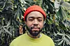 Terrace Martin green shirt, orange hat