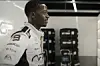 Damson Idris in an F1 racing uniform.