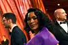 Angela Bassett attends the 95th Annual Academy Awards wearing a purple dress