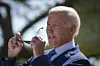 Joe Biden taking off sun glasses