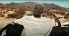 Mick Jenkins lounging in the desert in the video for 'Contacts'