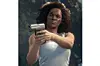 Nadine Ross from Uncharted holding a pistol.