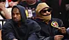 Kanye West (L) and Future look on courtside during the first half between the Miami Heat and the Minnesota Timberwolves at FTX Arena on March 12, 2022.