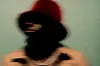 BLK ODYSSY in red hat. Blurry Photo.