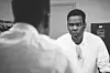 Chris Rock looking into a mirror