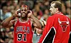 Chicago bull dennis rodmanl reacts to being thro