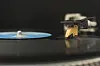 A vinyl record spins under an Ortofon N120 needle.