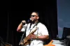 BAMSFest performer and Berklee College of Music associate professor Tim Hall, plays saxophone and relays spoken word rhymes about family and music in Franklin Park, June 23, 2023.