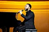 John Legend performs on stage during Ronald McDonald House Charities (RMHC) 50th Anniversary Gala on November 16, 2024 in Chicago, Illinois.