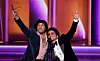 Anderson .Paak and Bruno Mars of Silk Sonic accept the Record Of The Year award for ‘Leave The Door Open’ onstage during the 64th Annual GRAMMY Awards at MGM Grand Garden Arena on April 03, 2022 in Las Vegas, Nevada.