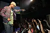Common performing, wearing hat