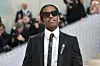 ASAP Rocky wearing sunglasses, wearing a suit