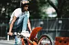 Kid riding bike Charm City Kings movie