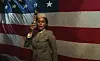 Janelle Monáe in front of american flag